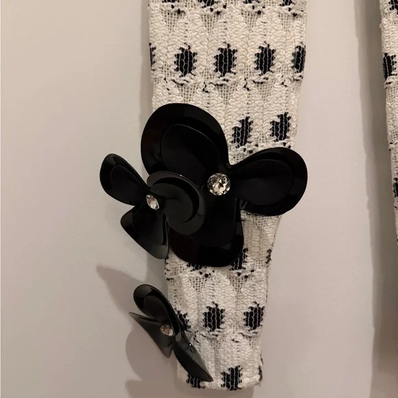 AREA eye crochet knit pants featuring crystal flower applique